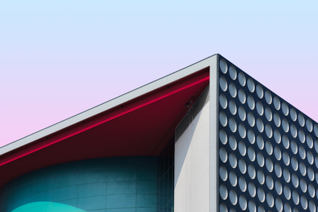 A pink building facade against the sky